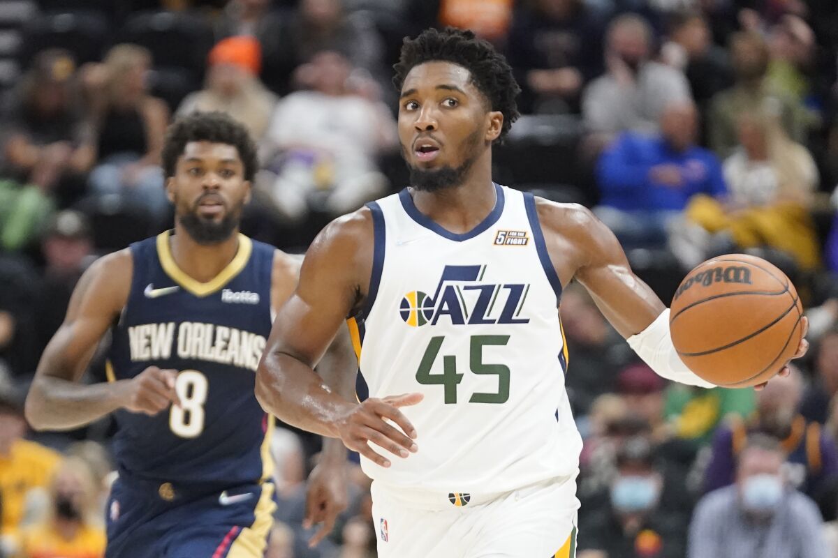 Utah Jazz guard Donovan Mitchell (45) brings the ball upcourt in the second half of a preseason NBA basketball game against the New Orleans Pelicans, Monday, Oct. 11, 2021, in Salt Lake City. (AP Photo/Rick Bowmer)