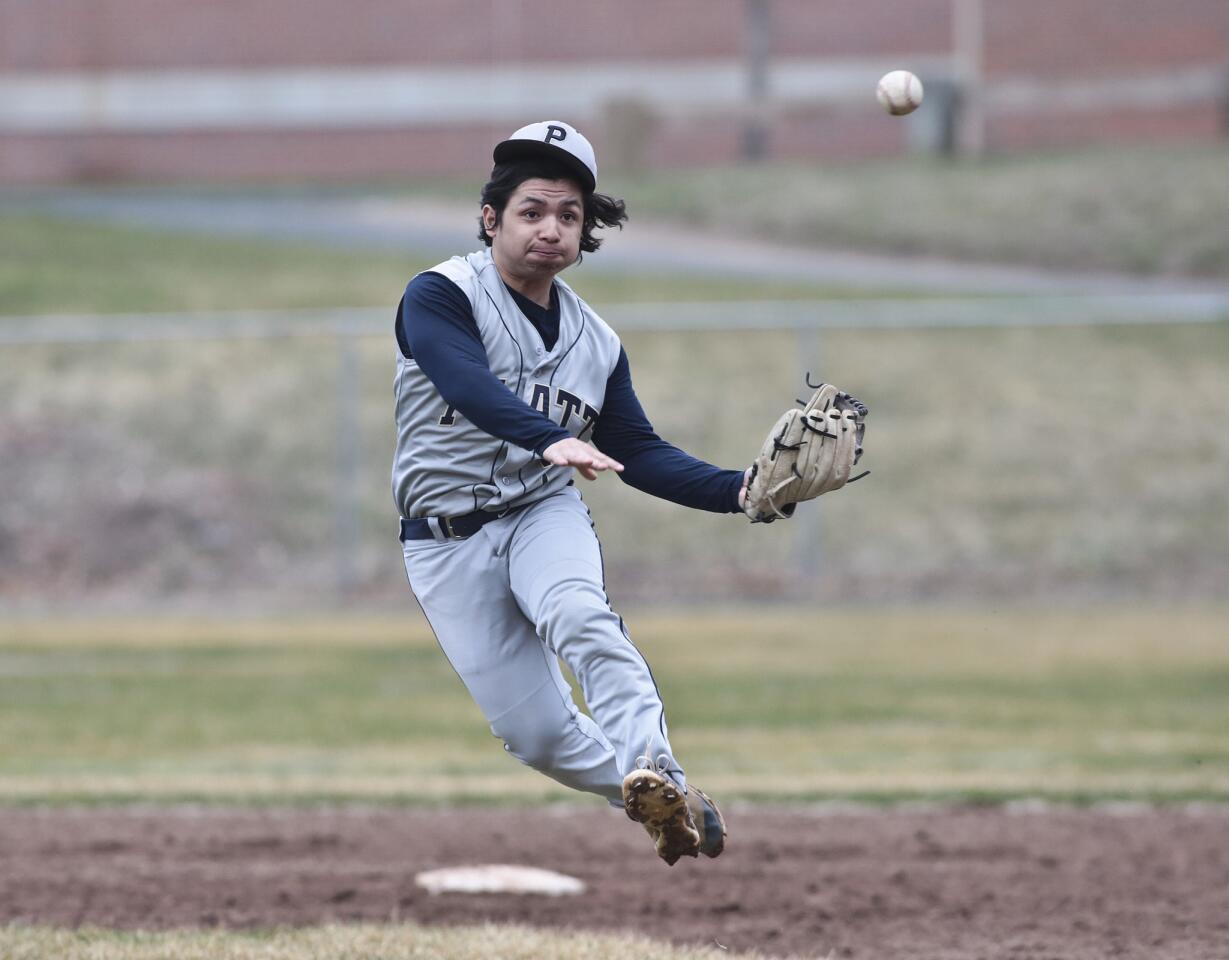 Platt second baseman Peyton Theil makes a play to first against Avon to end the 3rd inning. Platt plays Avon High School at Avon Tuesday. Michael McAndrews - Special to the Hartford Courant