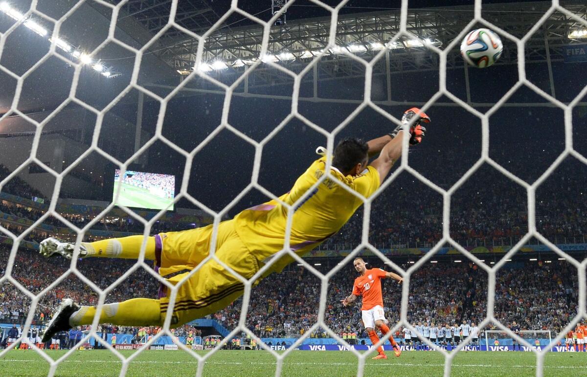 Argentina goalkeeper Sergio Romero saves a shot from Netherlands midfielder Wesley Sneijder during the penalty-kick shootout that decided their World Cup semifinal Wednesday.