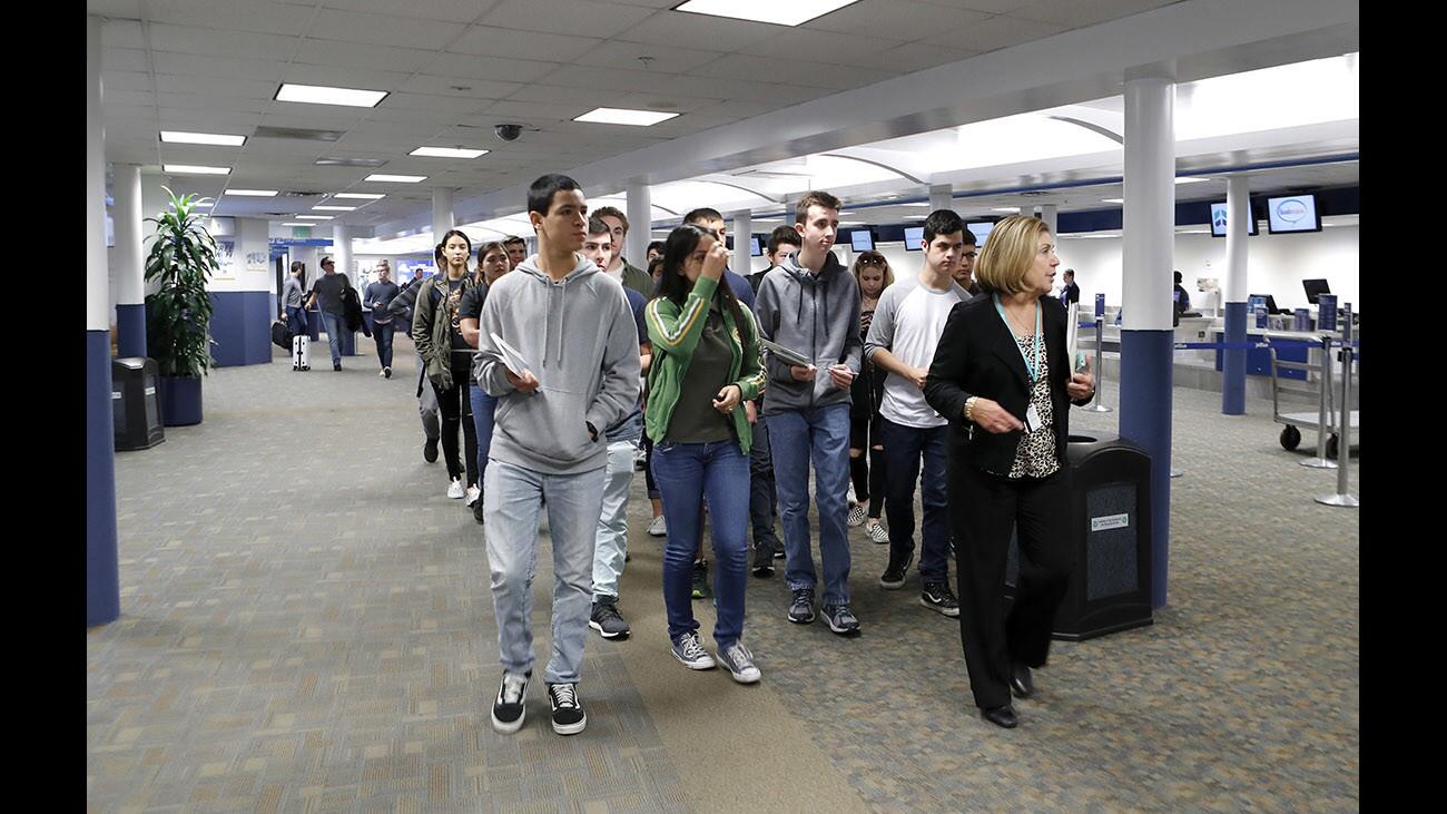 Public Affairs Director Lucy Burghdorf leads students from Burbank and Burroughs High Schools, on a tour of the Hollywood Burbank Airport as they participate in the airportâ€™s first Airport academy, in Burbank on Thursday, Jan. 17, 2018. The Burbank Unified School District students will learn all about the aviation industry.