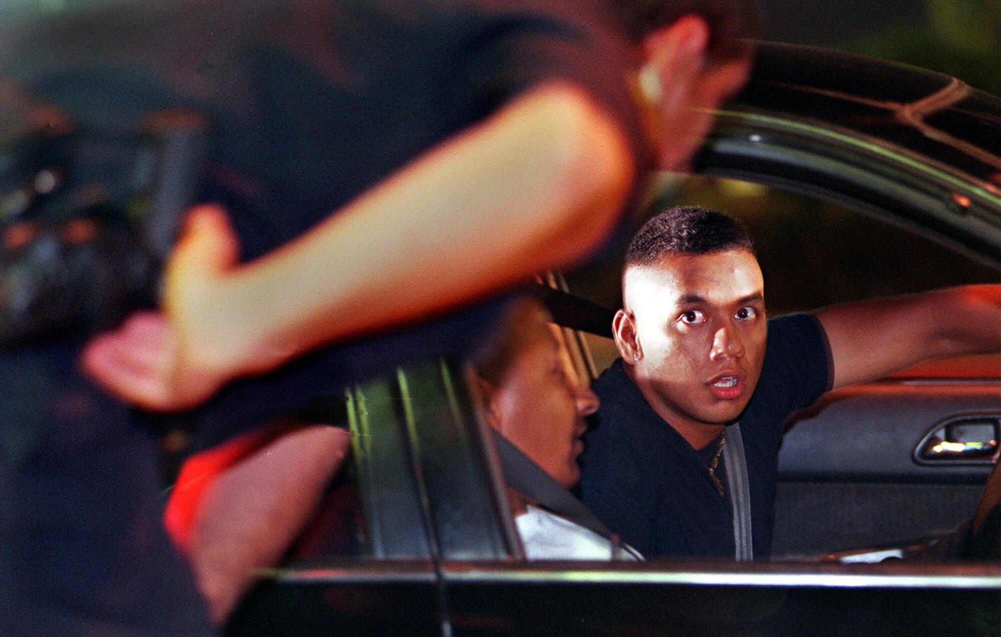 National City Police Officer F. Dominguez, left talks to passenger Luis Herrera