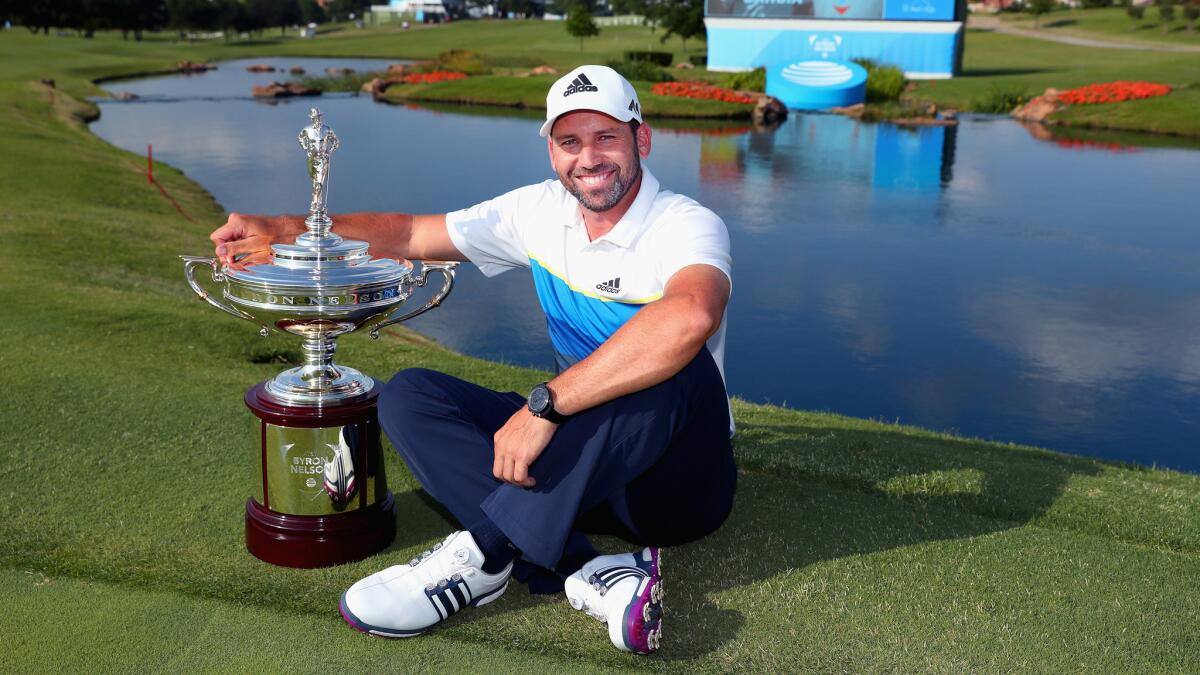 Sergio Garcia poses with the trophy after winning the AT&T Byron Nelson on Sunday.