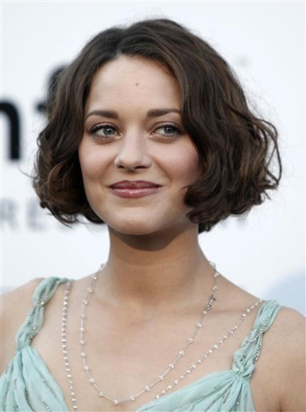 FILE - In this May 21, 2009 file photo, French actress Marion Cotillard arrives for the amfAR Cinema Against AIDS benefit at the Hotel du Cap-Eden-Roc, during the 62nd Cannes International film festival, in Antibes, southern France. (AP Photo/Matt Sayles, file)