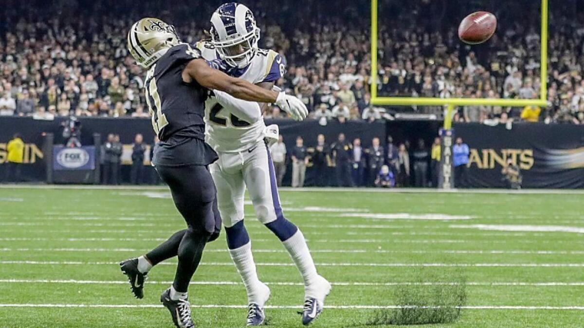 Rams cornerback Nickell Robey-Coleman hits Saints receiver Tommylee Lewis late in the fourth quarter, thwarting a potential game-winning drive in the NFC championship at the Superdome.