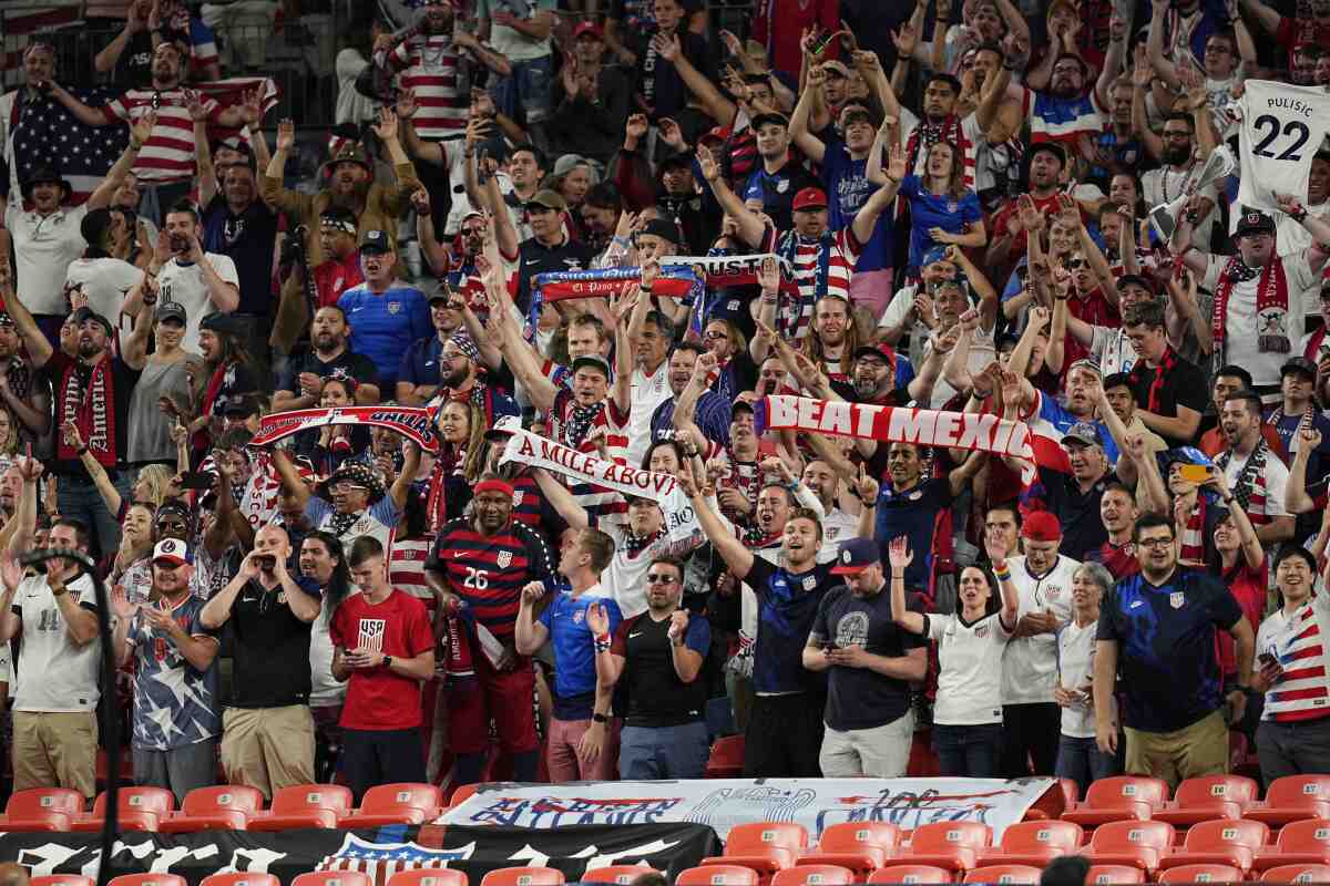 Soccer fans cheer for the United State during a CONCACAF competition in Denver.