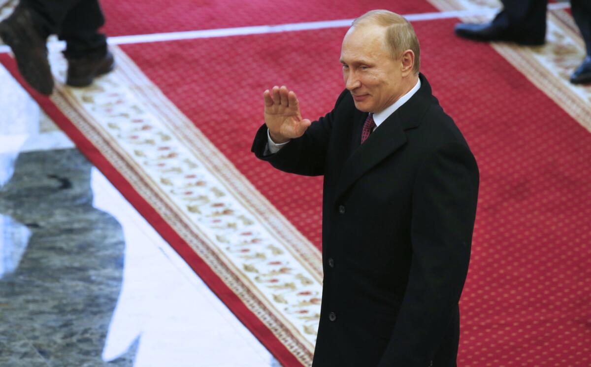 Russian President Vladimir Putin leaves peace talks in Minsk, Belarus, on Feb. 12.