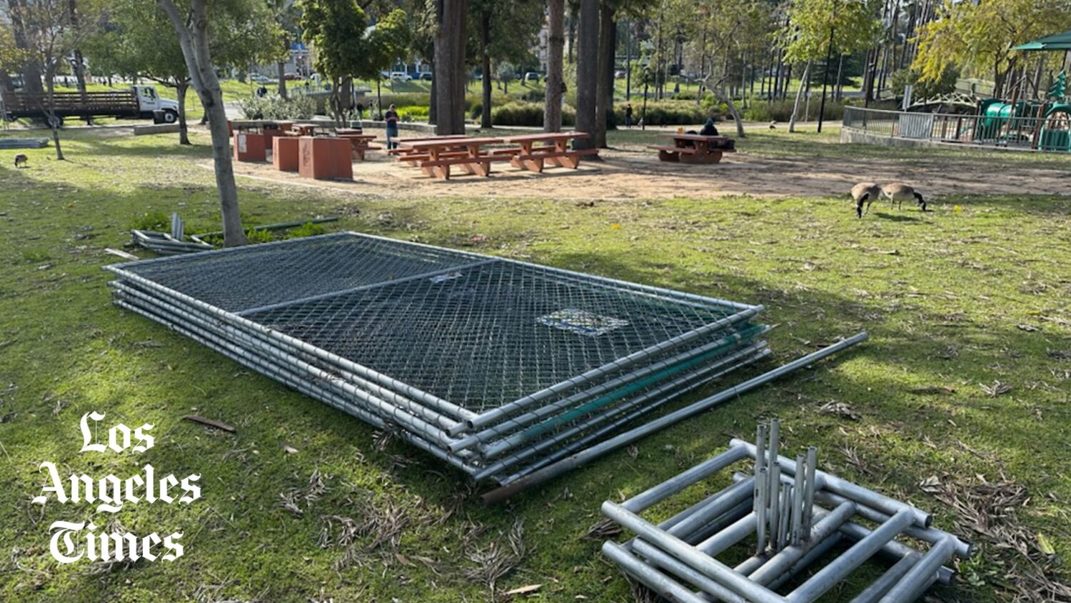 The fence around Echo Park Lake is being dismantled