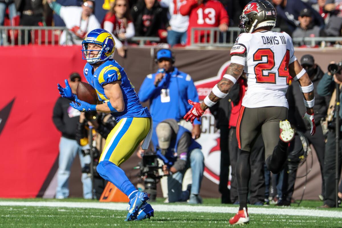 Rams wide receiver Cooper Kupp hauls in a long touchdown pass in front of Tampa Bay Buccaneers cornerback Carlton Davis.