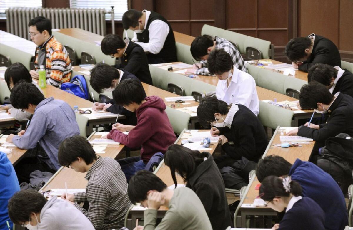 Students take the National Center Test for University Admissions at the University of Tokyo earlier this year. Students from Shanghai, Hong Kong, Singapore, Taiwan, Japan and South Korea were among the highest-ranking groups in math, science and reading in test results released last week by the Program for International Student Assessment.