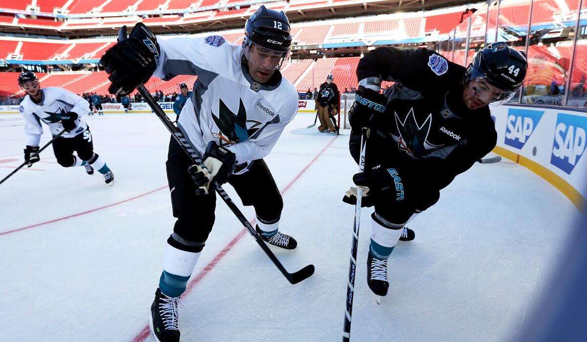 San Jose Sharks players Patrick Marleau, left, and Marc-Edouard Vlasic practice at Levi's Stadium for the 2015 Coors Light NHL Stadium Series game against the Kings.
