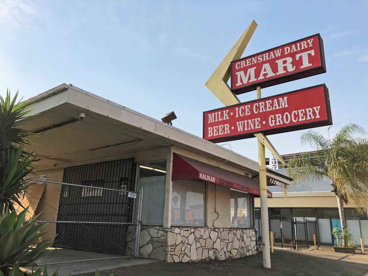 A 1960s-style mini mart has a red sign that reads "Crenshaw Dairy Mart" and a yellow Googie boomerang motif