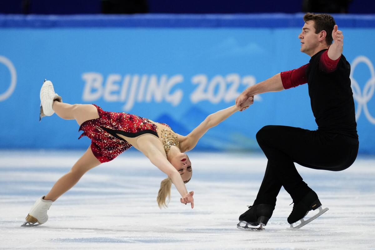 Alexa Knierim and Brandon Frazier, of the United States, compete in the pairs short program.