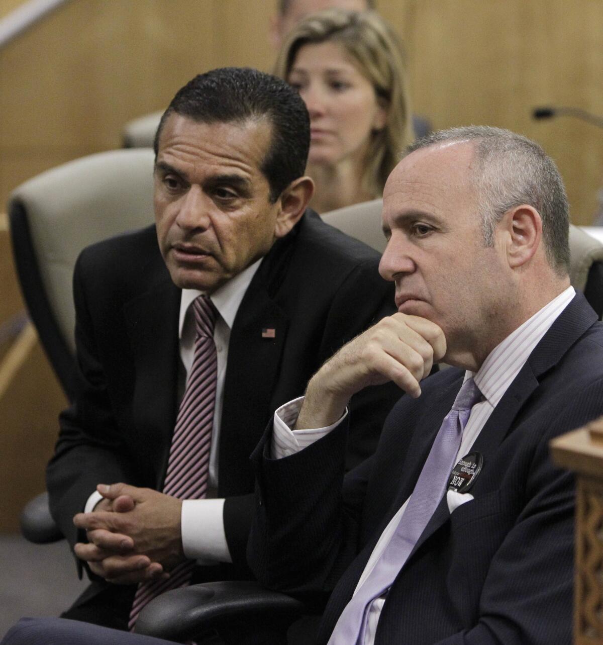 Los Angeles Mayor Antonio Villaraigosa, left, and Senate President Pro Tem Darrell Steinberg, D-Sacramento, listen as members call for the passage of Steinberg's measure to outlaw rifles with detachable magazines, while appearing before the Senate Public Safety Committee on Tuesday.