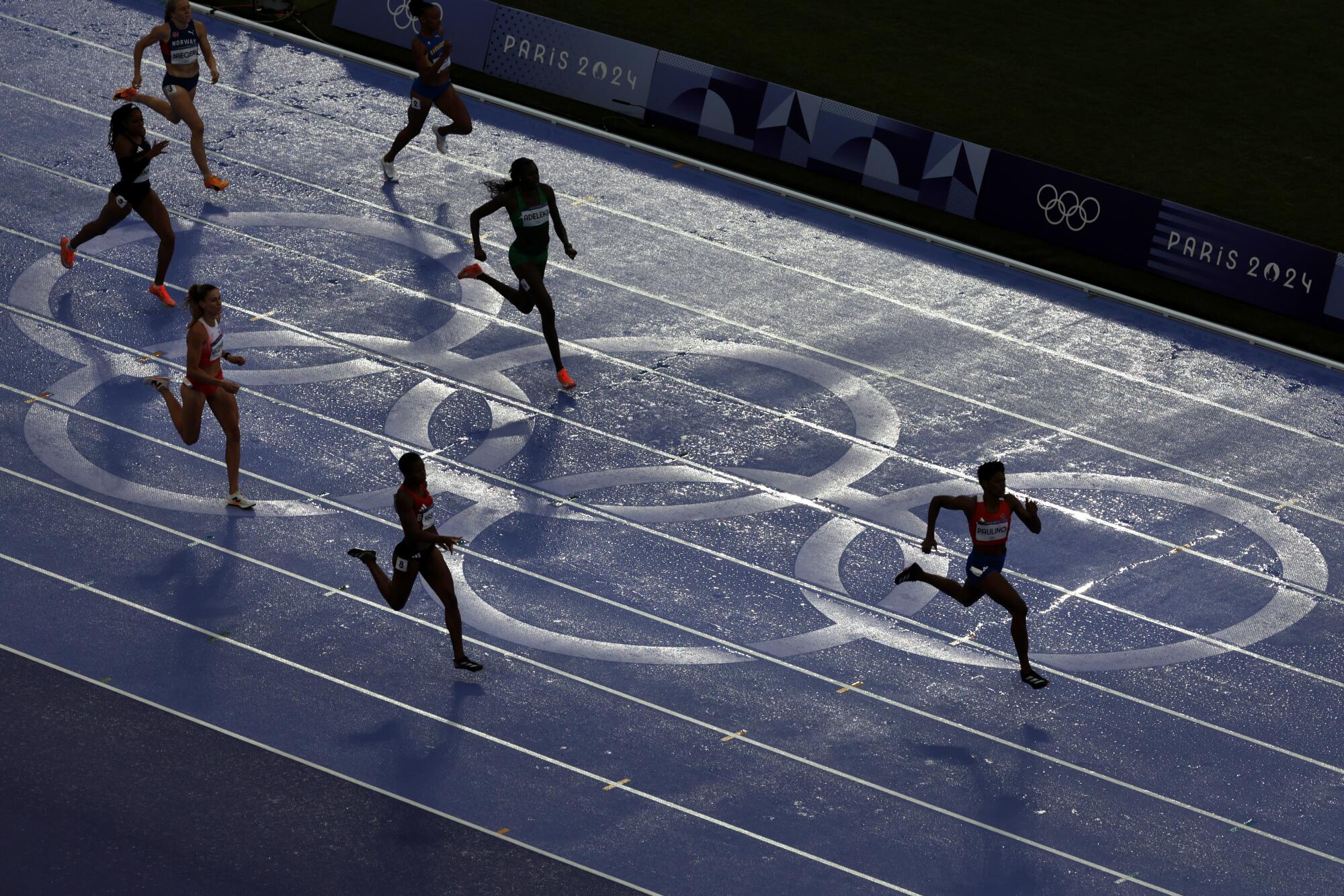 Women compete in the 400-meter final at the 2024 Paris Olympics Friday.