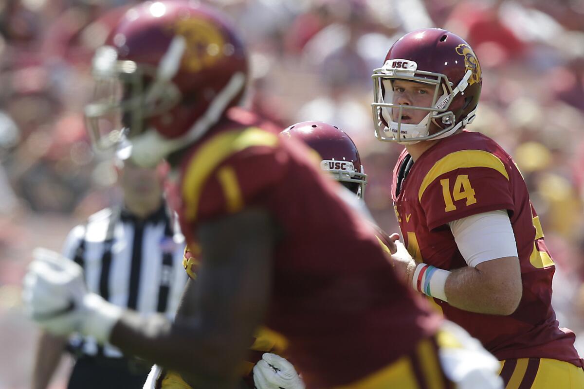 USC quarterback Sam Darnold (14) looks downfield as he prepares to throw a 15-yard touchdown pass to JuJu Smith-Schuster in the fourth quarter against Utah State.