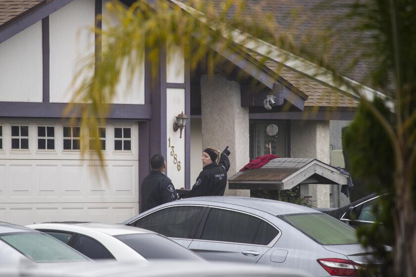 ONTARIO, CALIF. -- SATURDAY, DECEMBER 14, 2019: Ontario police crime scene investigators work the scene where two children and a county probation officer are killed in a shooting at Ontario home Saturday, Dec. 14, 2019. It started as a routine call for medical attention at an Ontario home early Saturday morning. But with a series of terrifying twists — a husband with gunshot wounds, a wife firing on arriving police, a five-hour hostage standoff — the call for help revealed a domestic tragedy. Just after dawn, SWAT officers forced their way into the home on East F Street and discovered the bodies of the woman who had shot at police, a teenage girl and an elementary school-age boy, police said. Police did not identify the deceased, but said the woman was an off-duty San Bernardino County probation officer. Her husband, who escaped the home when police arrived, is being treated for life-threatening injuries. (Allen J. Schaben / Los Angeles Times)