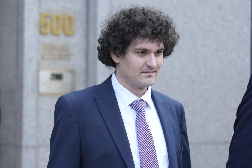 FILE - FTX founder Sam Bankman-Fried leaves Federal court, July 26, 2023, in New York. Jury selection begins Tuesday, Oct. 3 in a case in which the 31-year-old crypto mogul faces the possibility of a long prison term if convicted. Prosecutors say he cheated thousands of people who deposited cryptocurrency on the FTX exchange by illegally diverting massive sums of their money for his personal use, including making risky trades at his cryptocurrency hedge fund. (AP Photo/Mary Altaffer, File)