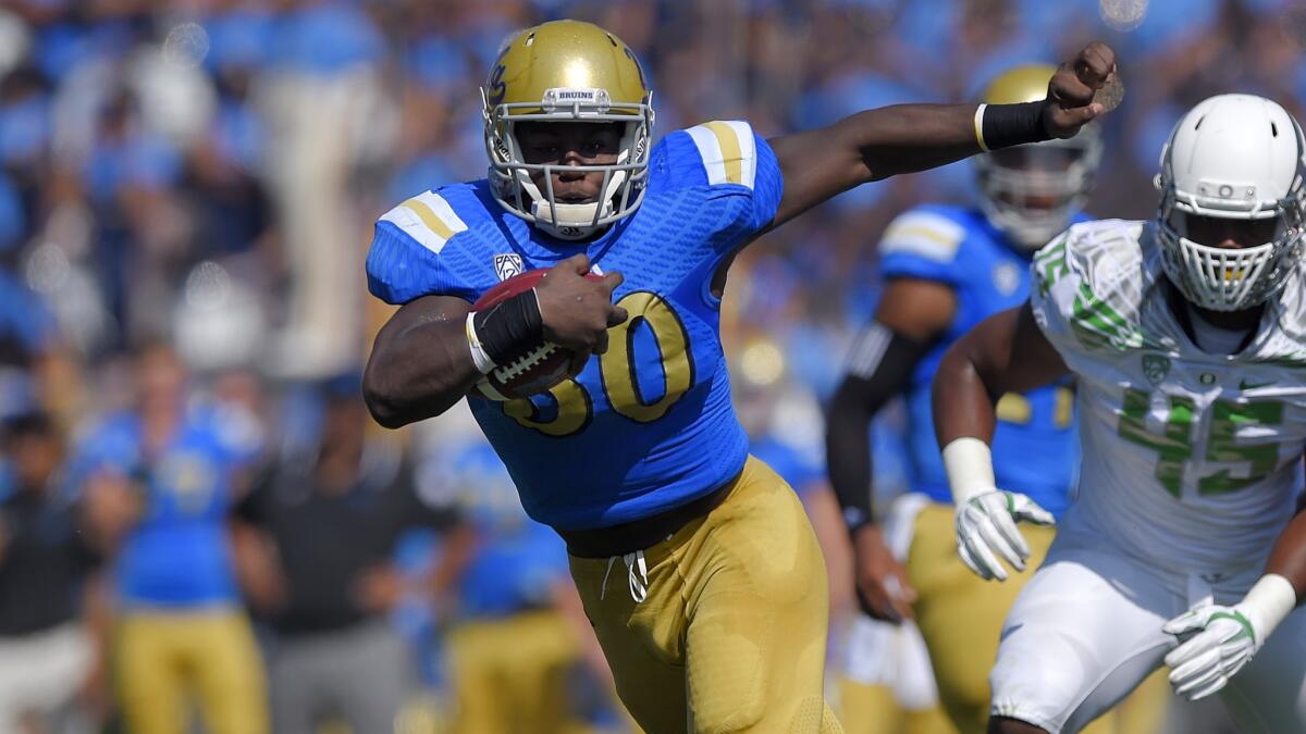 UCLA running back Myles Jack tries to avoid a tackle during the first half of the Bruins' loss to Oregon on Oct. 11.