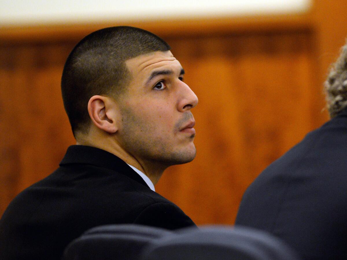 Former New England Patriots tight end Aaron Hernandez attends a pre-trial hearing at the Bristol County Superior Court in Fall River, Mass., on Tuesday. Hernandez has been charged with murder in the death of Odin Lloyd.