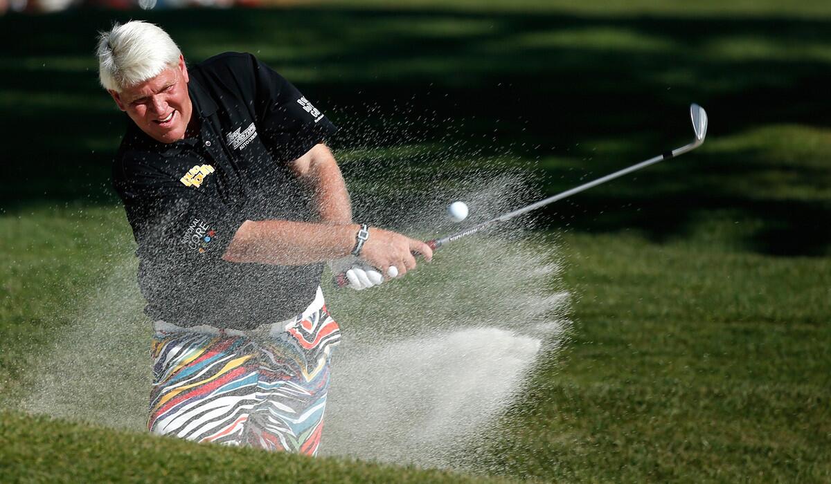 John Daly hits a bunker shot on the 18th hole during the first round of the AT&T Pebble Beach National Pro-Am on Thursday.