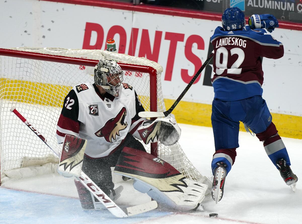 Arizona Coyotes goaltender Antti Raanta, left, makes a skate save of a shot by Colorado Avalanche left wing Gabriel Landeskog in the third period of an NHL hockey game Monday, March 8, 2021, in Denver. The Coyotes won 3-2. (AP Photo/David Zalubowski)