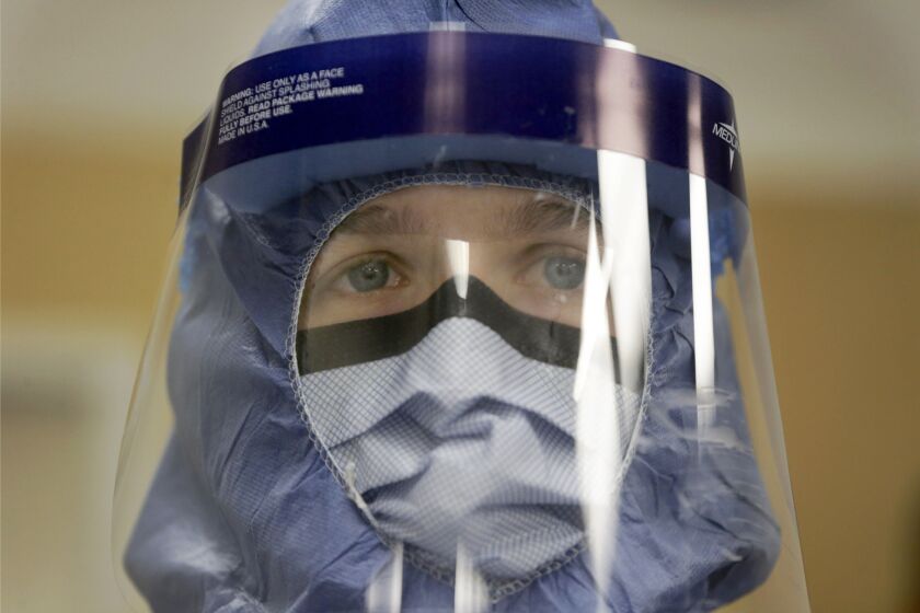 A nurse wears protective equipment during a training class at Rush University Medical Center in Chicago.