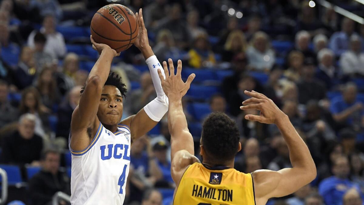 UCLA's Jaylen Hands takes a shot over California's Nick Hamilton defends on Jan. 25.