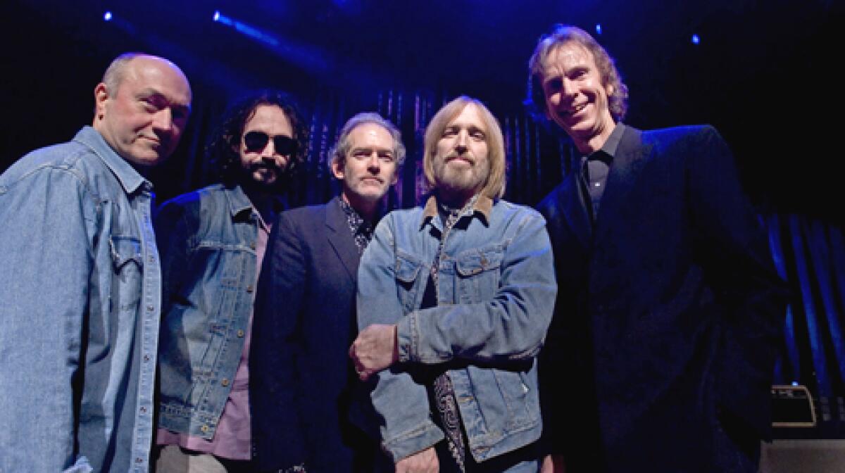 MUDCRUTCH: Randall Marsh, left, Mike Campbell, Benmont Tench, Petty and Tom Leadon got together at Pettys behest. This is all about the music, Petty says. Being in this band is so much fun."