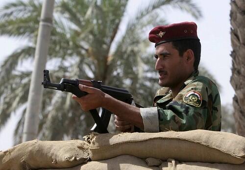 An Iraqi police officer mans a checkpoint in the southern city of Basra.