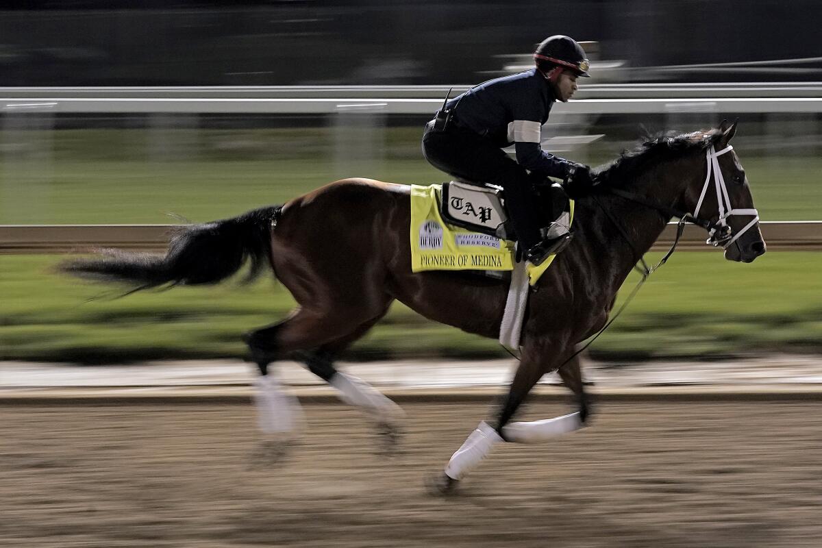 Kentucky Derby entrant Pioneer of Medina works out at Churchill Downs on Thursday.