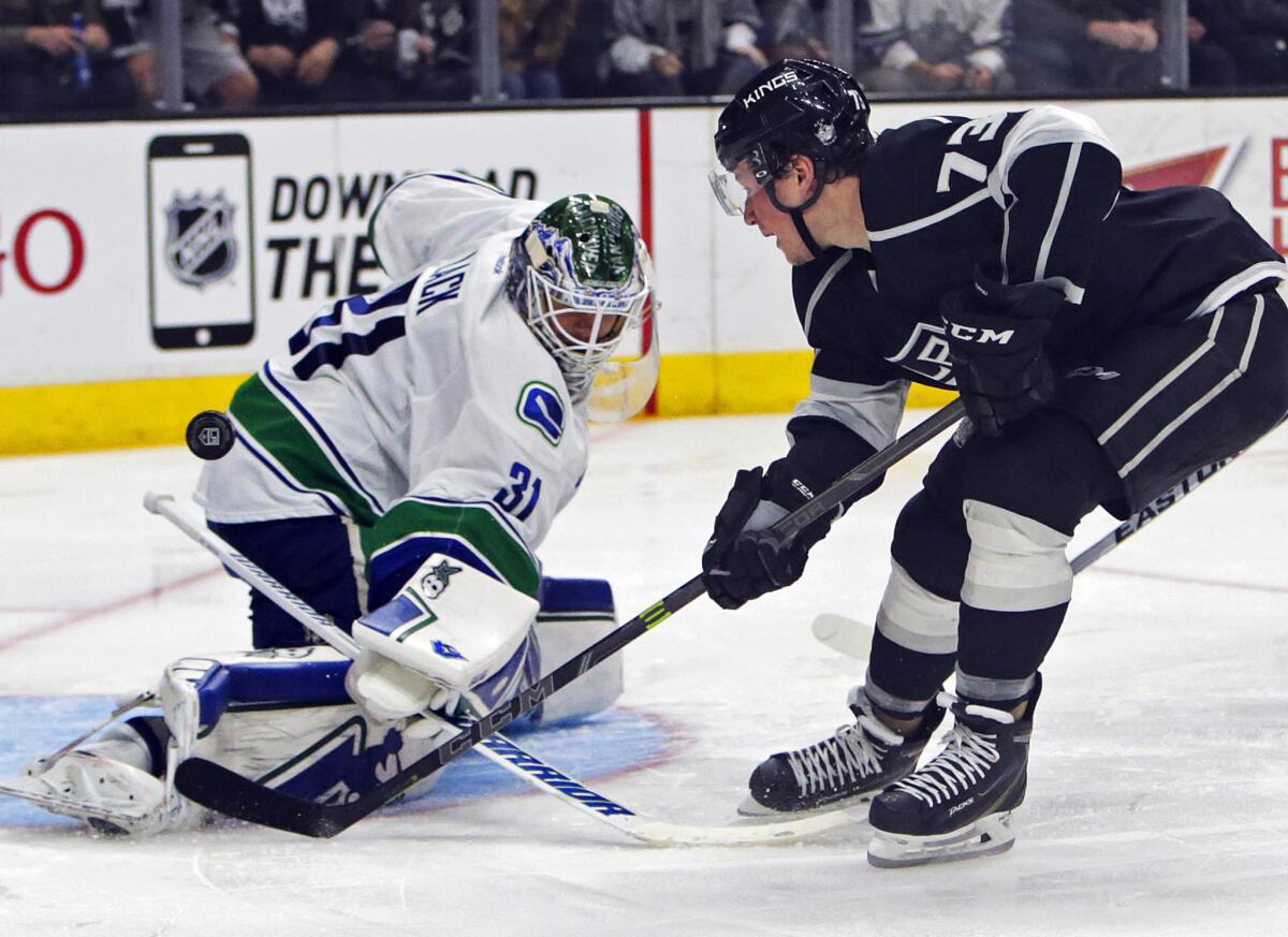 Kings forward Tyler Toffoli tries to chip a shot past Vancouver goalie Eddie Lack during a game March 21 at Staples Center.