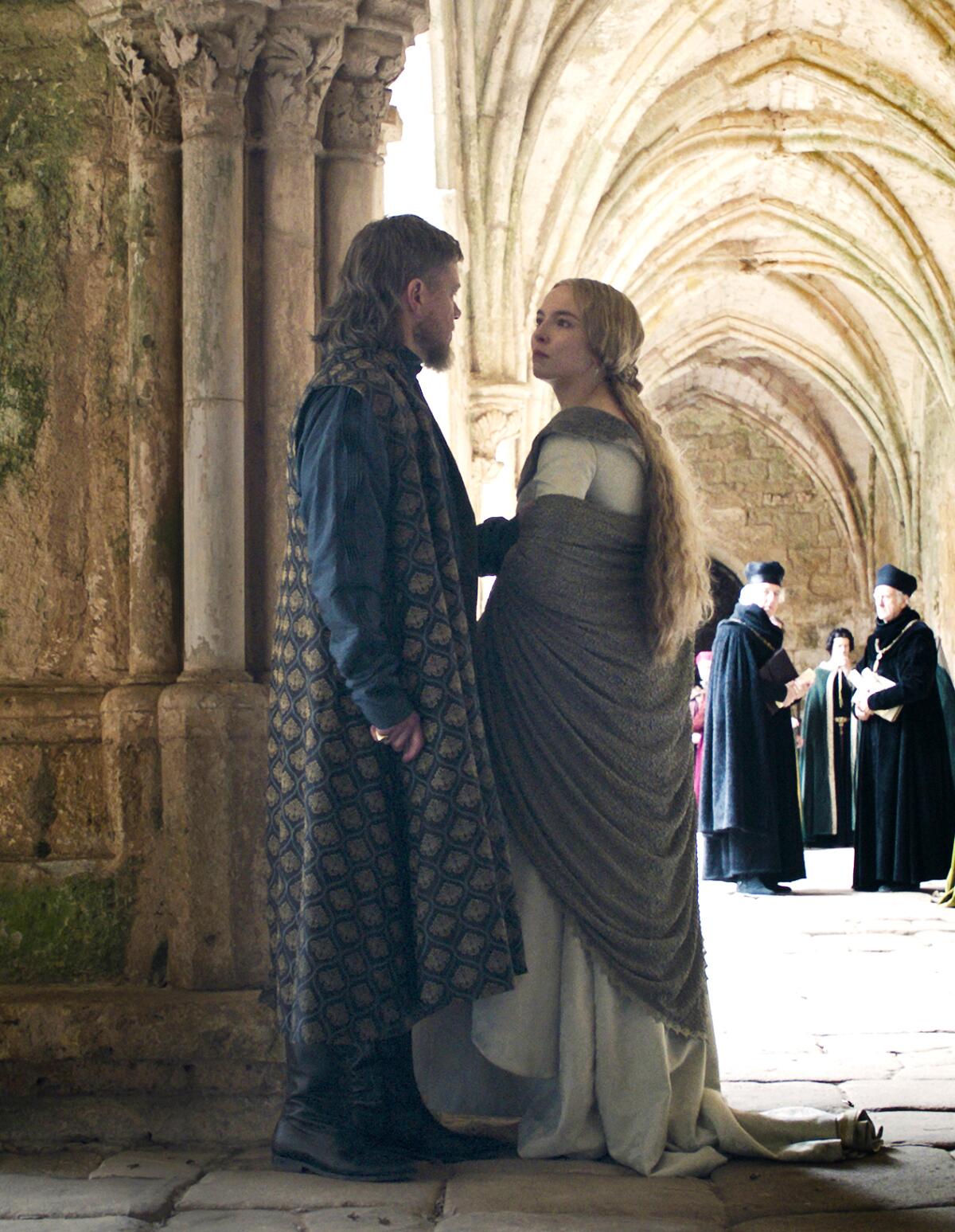 Matt Damon as Jean de Carrouges and Jodie Comer as Marguerite de Carrouges in medieval period costumes in "The Last Duel."