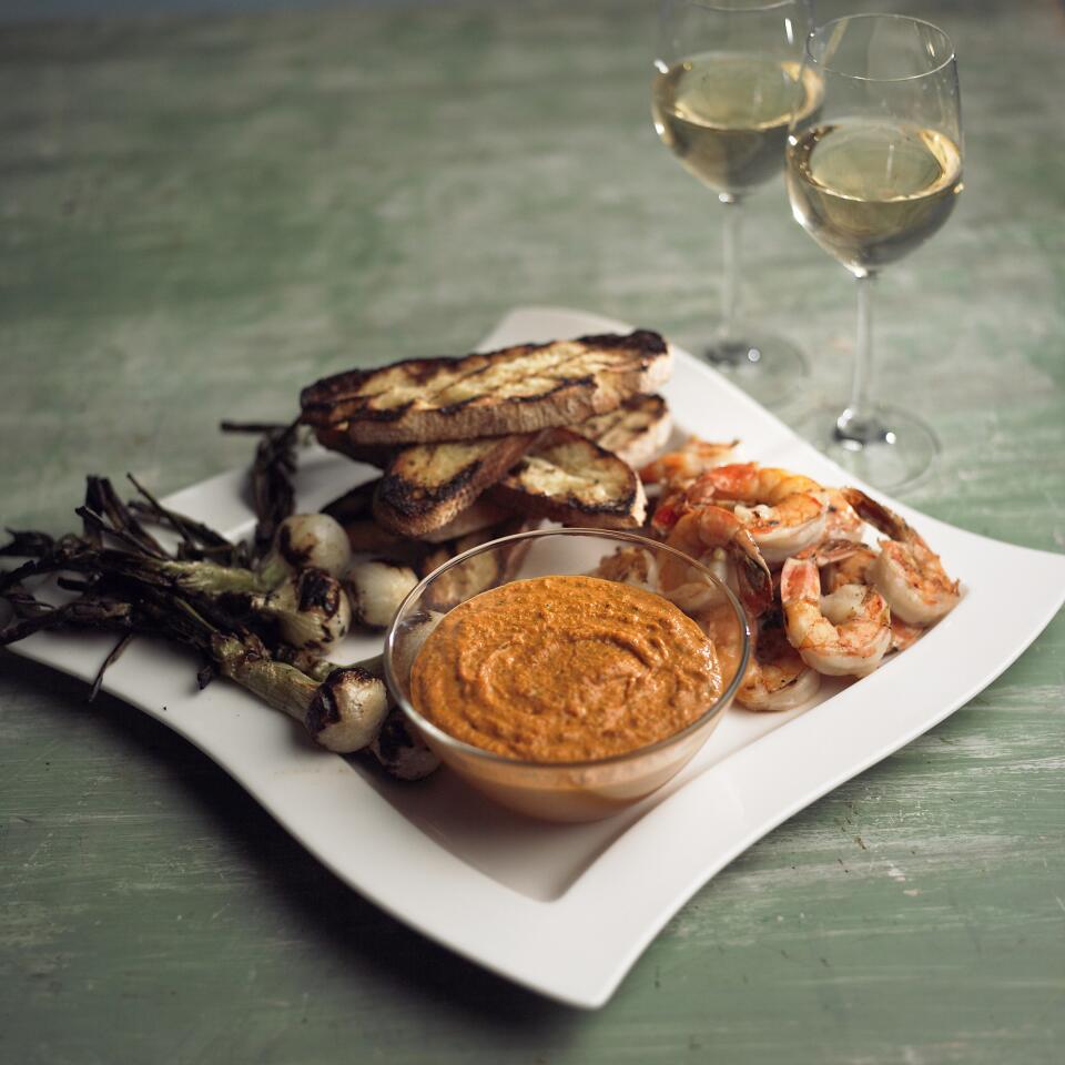 Romesco with grilled bread, spring onions and shrimp