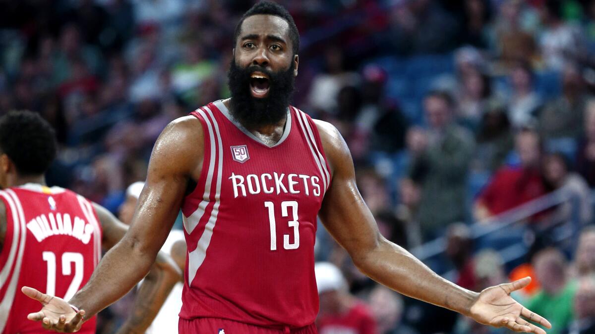Rockets guard James Harden reacts to a play during the second half of the game against the Pelicans on Friday night.