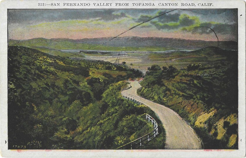 A winding road leads to the undeveloped San Fernando Valley on this vintage postcard
