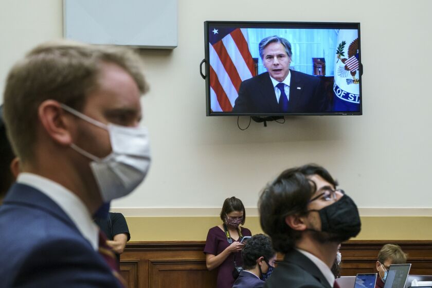 Secretary of State Antony Blinken appears remotely on a TV monitor to answer questions from the House Foreign Affairs Committee about the U.S. withdrawal from Afghanistan, at the Capitol in Washington, Monday, Sept. 13, 2021. (AP Photo/J. Scott Applewhite)