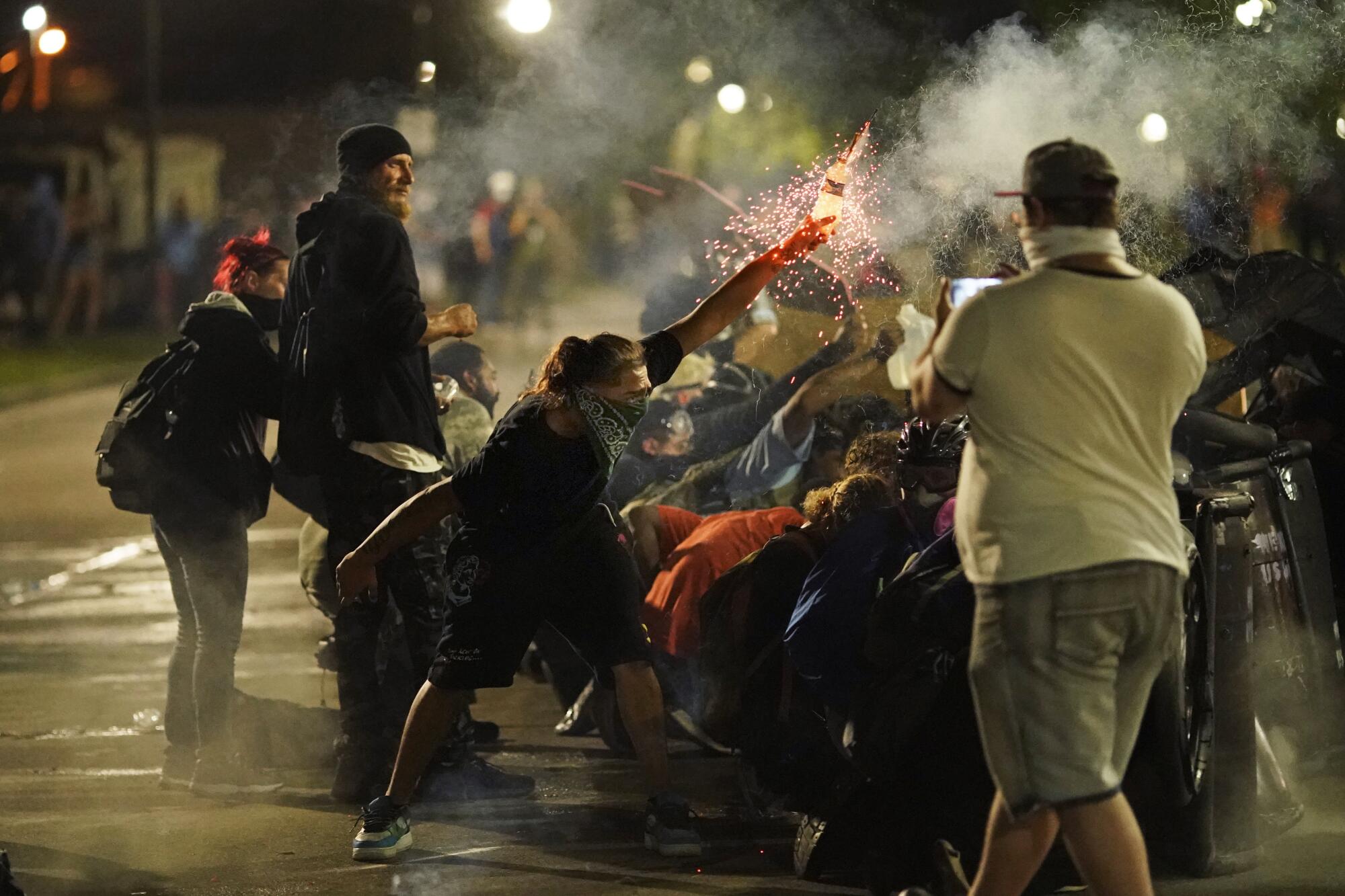 A protester tosses