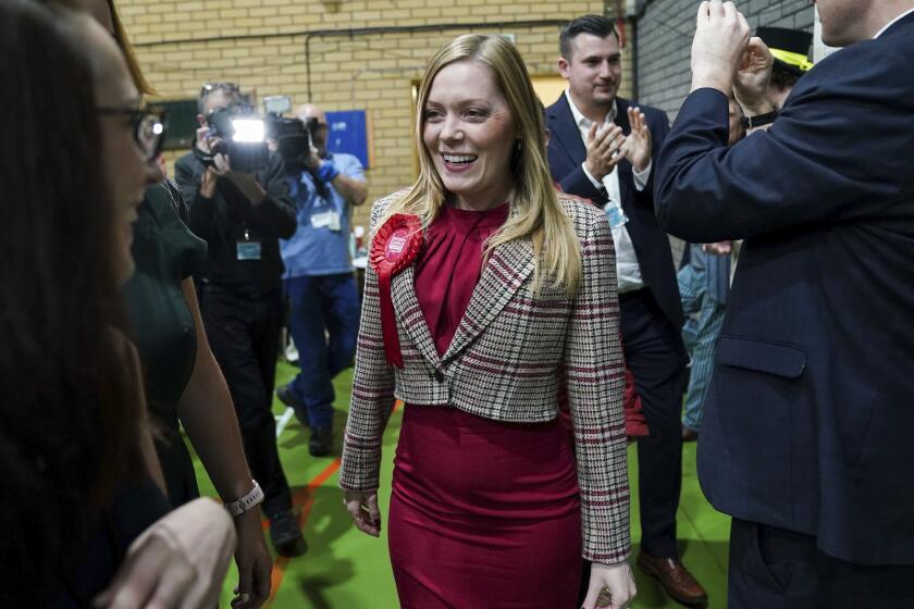 Labour candidate Sarah Edwards arrives for the Tamworth by-election count at The Rawlett School, in Tamworth, England, Friday, Oct. 20, 2023. The seat was vacated following the resignation of Conservative MP Chris Pincher on September 7. (Jacob King/PA via AP)
