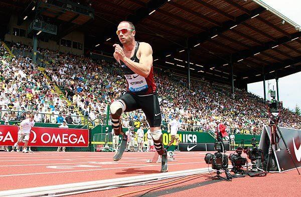 Oscar Pistorius bolts from the blocks for the 400-meter race during the Prefontaine Classic track and field meet in Eugene, Ore., earlier this month. The South African with prosthetics would finish eighth.