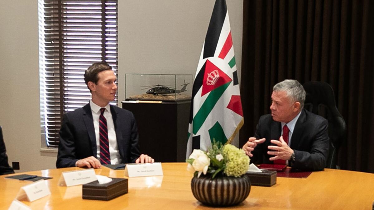 Jordanian King Abdullah II, right, meets with President Trump's son-in-law and senior advisor, Jared Kushner, in Amman on Wednesday.
