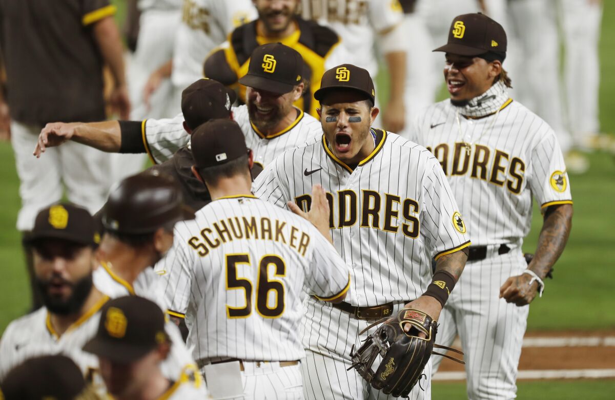 The Padres' Manny Machado celebrates with teammates after San Diego beat St. Louis on Oct. 2, 2020. 