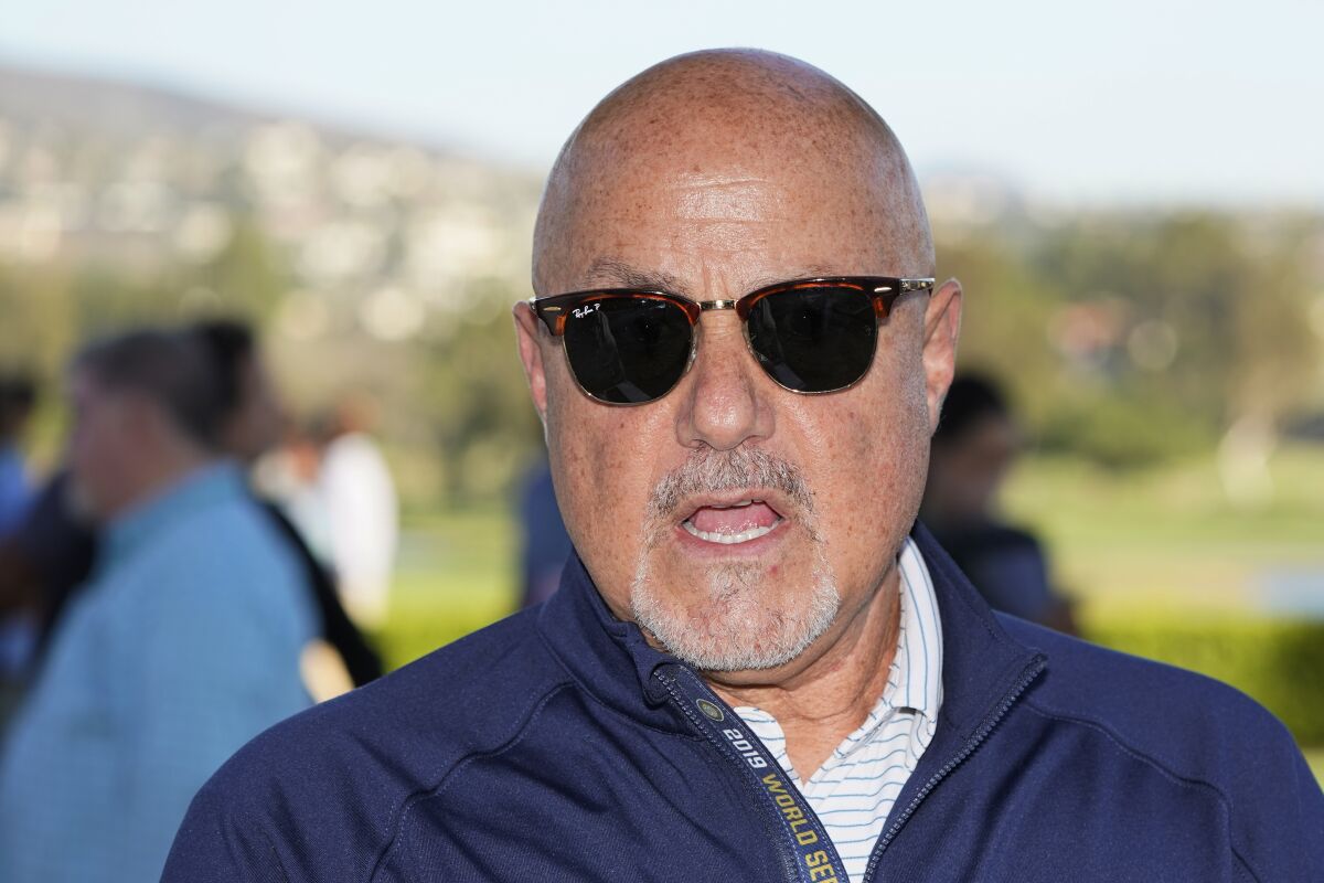 FILE - Washington Nationals general manager Mike Rizzo talks with reporters during Major League Baseball's general manager meetings, Wednesday, Nov. 10, 2021, in Carlsbad, Calif. Rizzo has worked to bring aboard a number of older, experienced veterans as spring training gets under way for his youngster-filled club in West Palm Beach, Fla. (AP Photo/Gregory Bull, File)