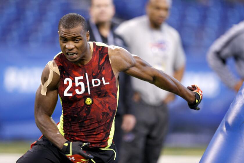 Oregon defensive end Dion Jordan goes through a drill during the NFL combine.