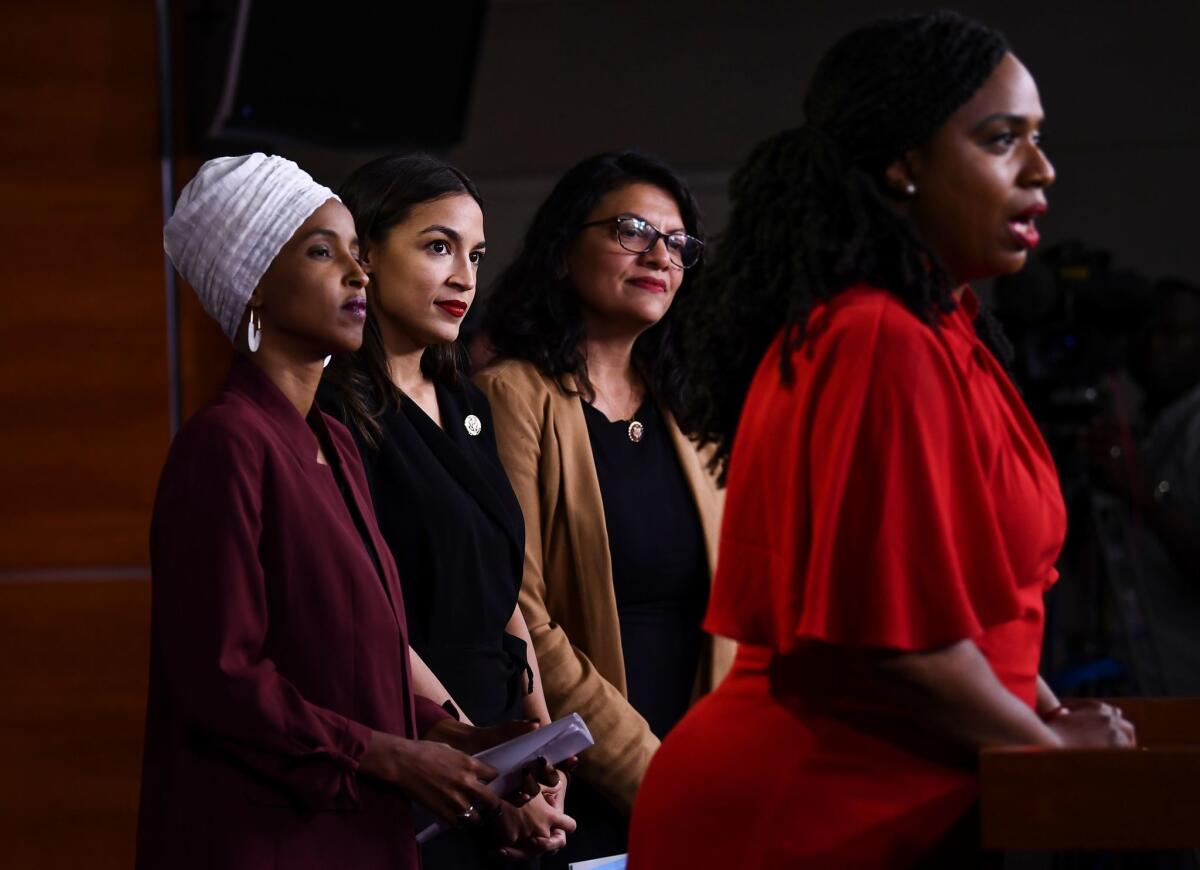 U.S. Reps. Ilhan Omar, left, Alexandria Ocasio-Cortez, Rashida Tlaib and Ayanna Pressley 