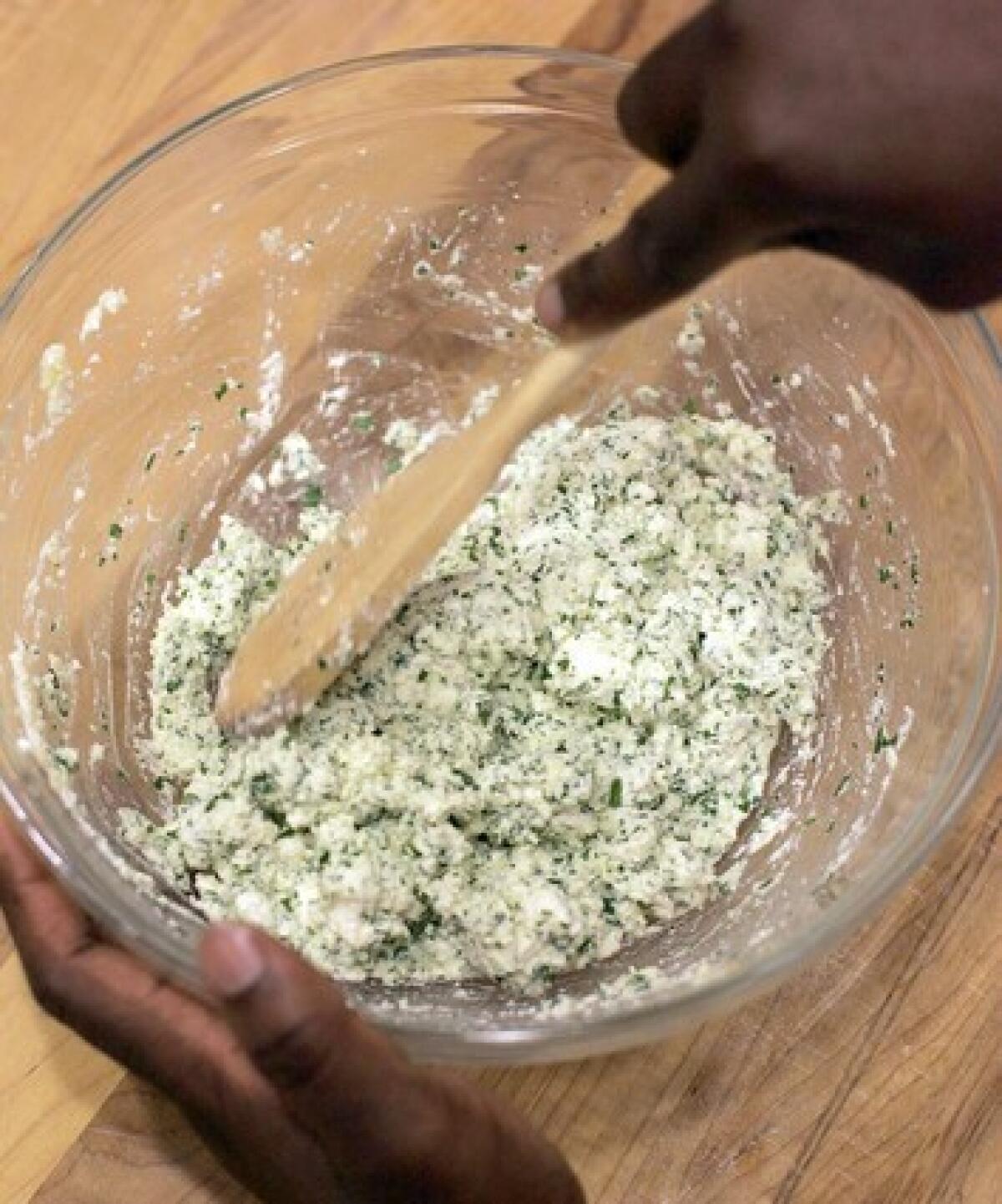 Stir together ricotta, Parmigiano-Reggiano, parsley, salt and egg until well-combined.