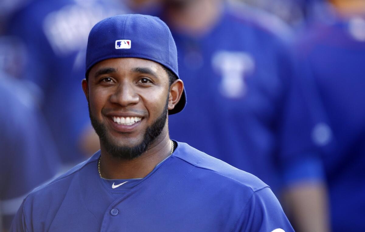 Texas’ Elvis Andrus smiles in the dugout before the Rangers' game against the Angels in Anaheim on Saturday.