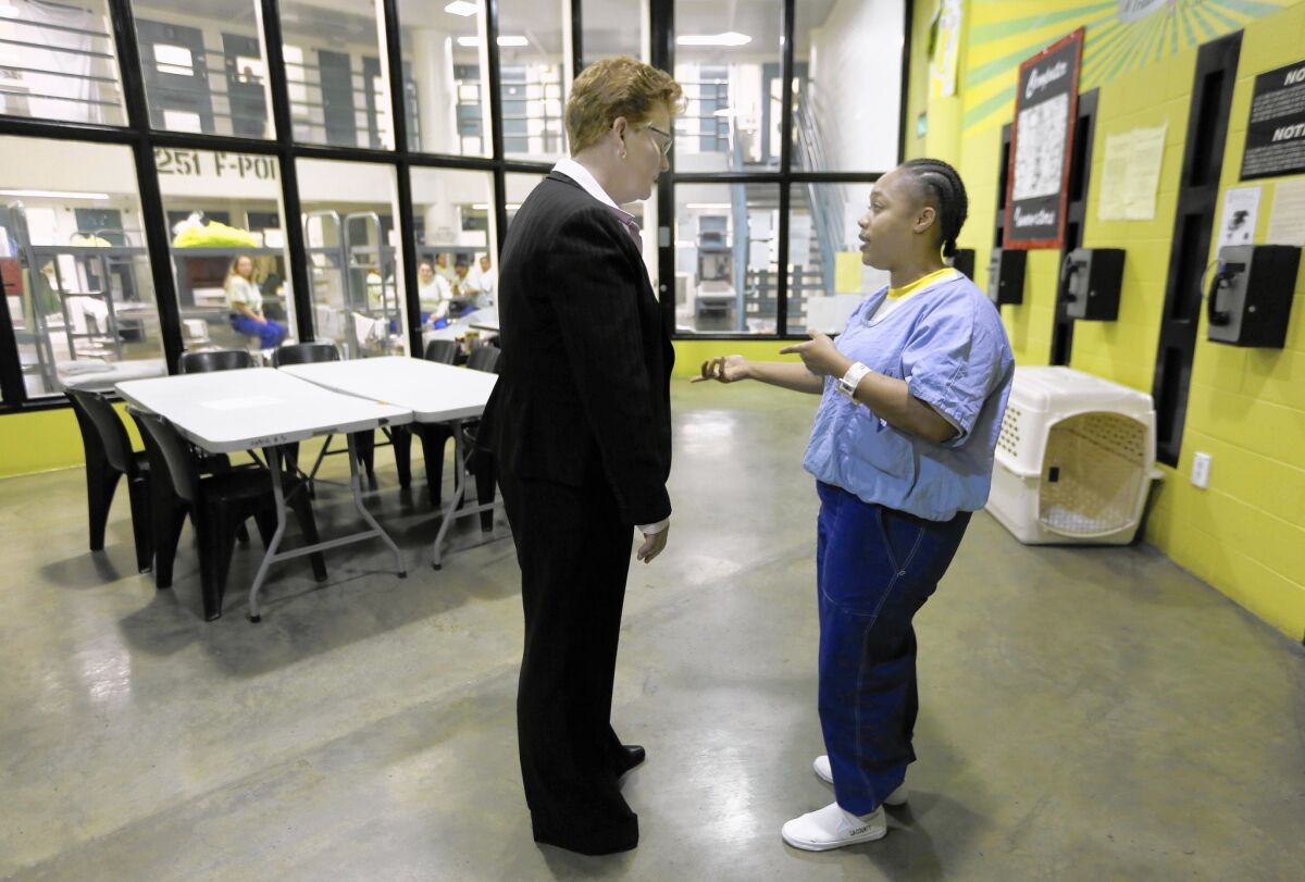 Assistant Sheriff Terri McDonald, who is stepping down after three years of overseeing L.A. County's jails, chats with inmate Pracille Harrell at the Twin Towers Correctional Facility.