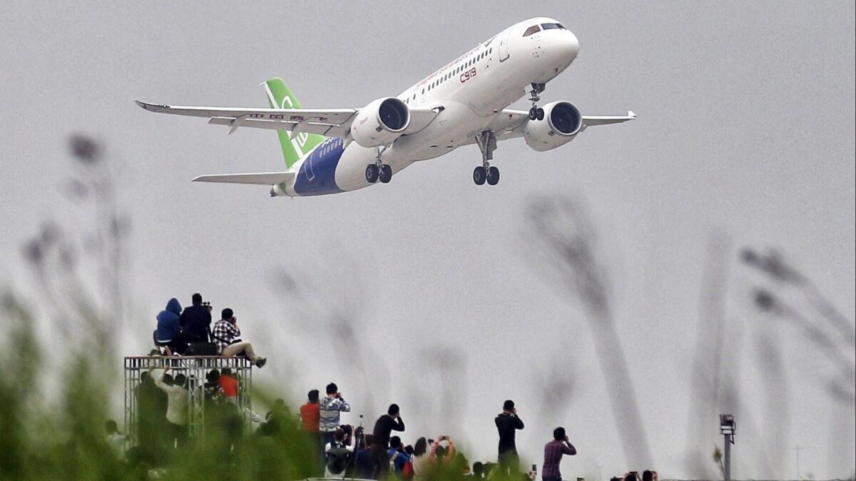 A Chinese-made Comac C919 takes off in 2017. The plane may not enter service until 2022, said one analyst.