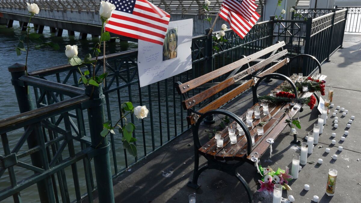 Flowers and a portrait of Kate Steinle remain at a memorial site on Pier 14 in San Francisco on Dec. 1.