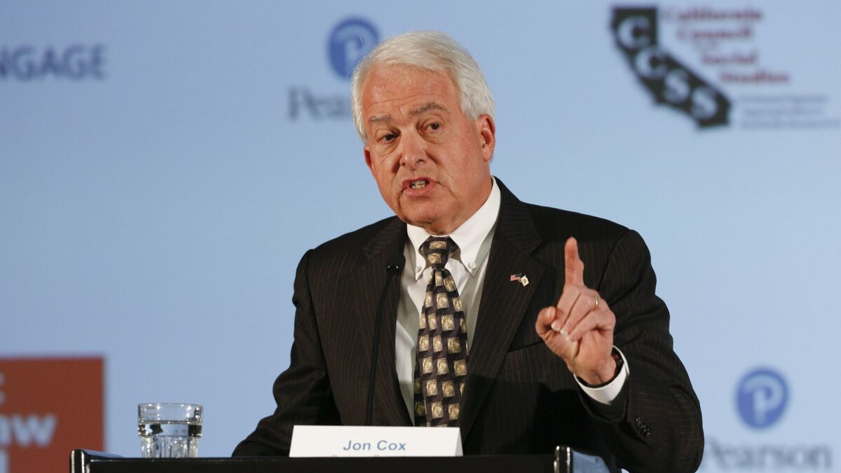 John Cox, a businessman and a Republican running for governor, answers a question during a debate in March in San Diego.